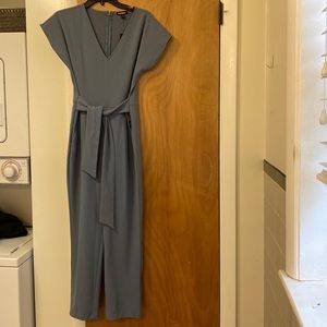 Blue jumpsuit with wrap tie front